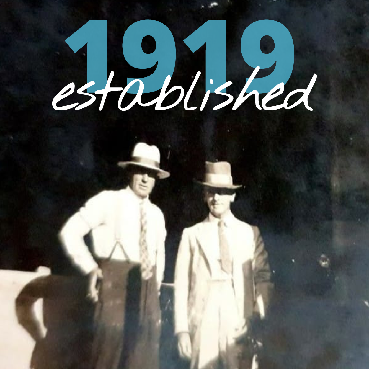 Photo of two men wearing white suits and hats