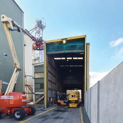 External view of grain intake area where CSG techs are working on an elevated platform